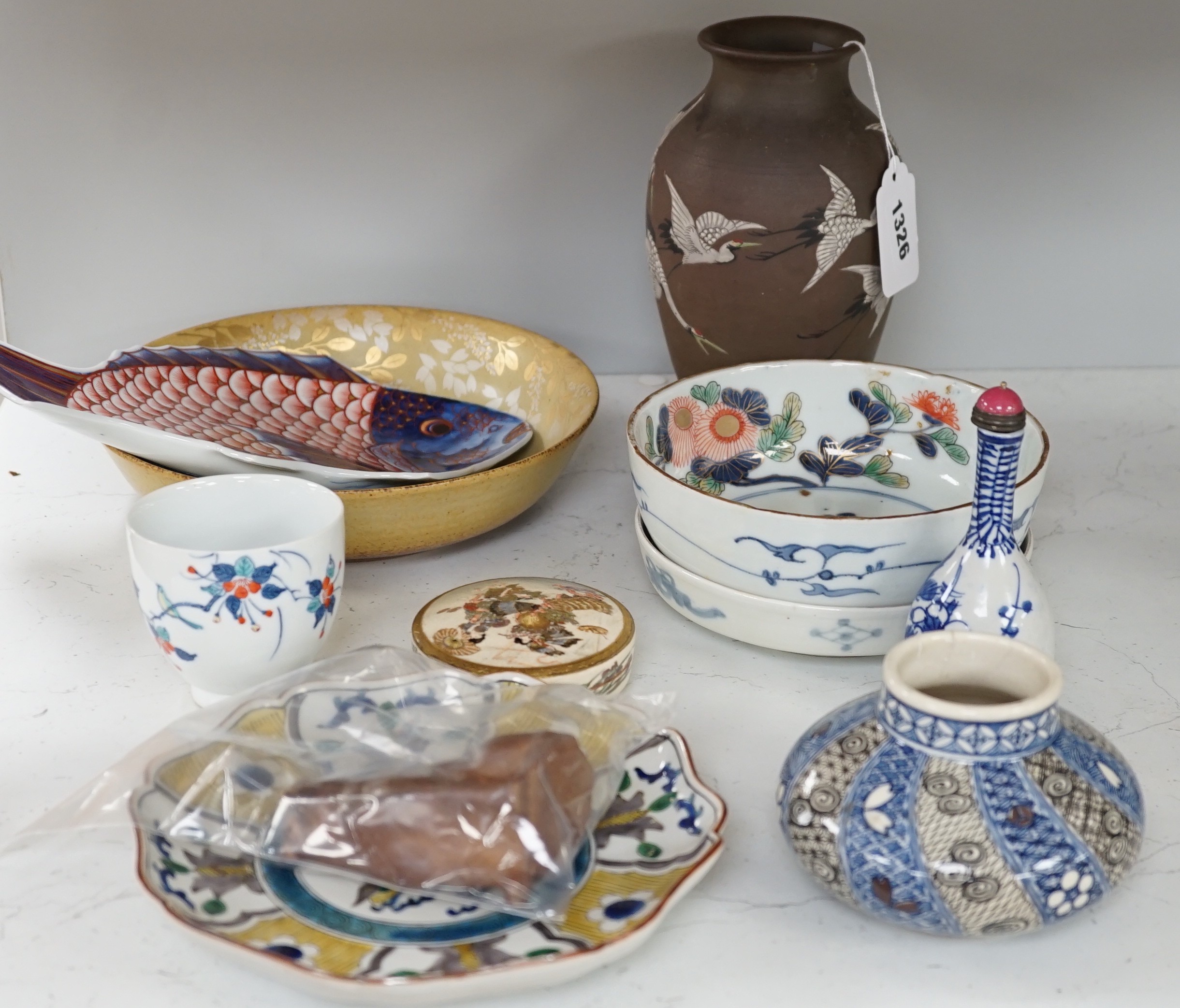 A group of 19th/20th century Japanese ceramics, Including five dishes, three vases, a cup, a Satsuma box and cover and a model of a dog